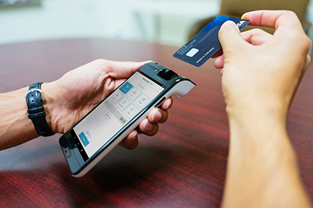 Customer swiping a card 