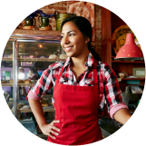 Lady-in-red-apron-in-bakery